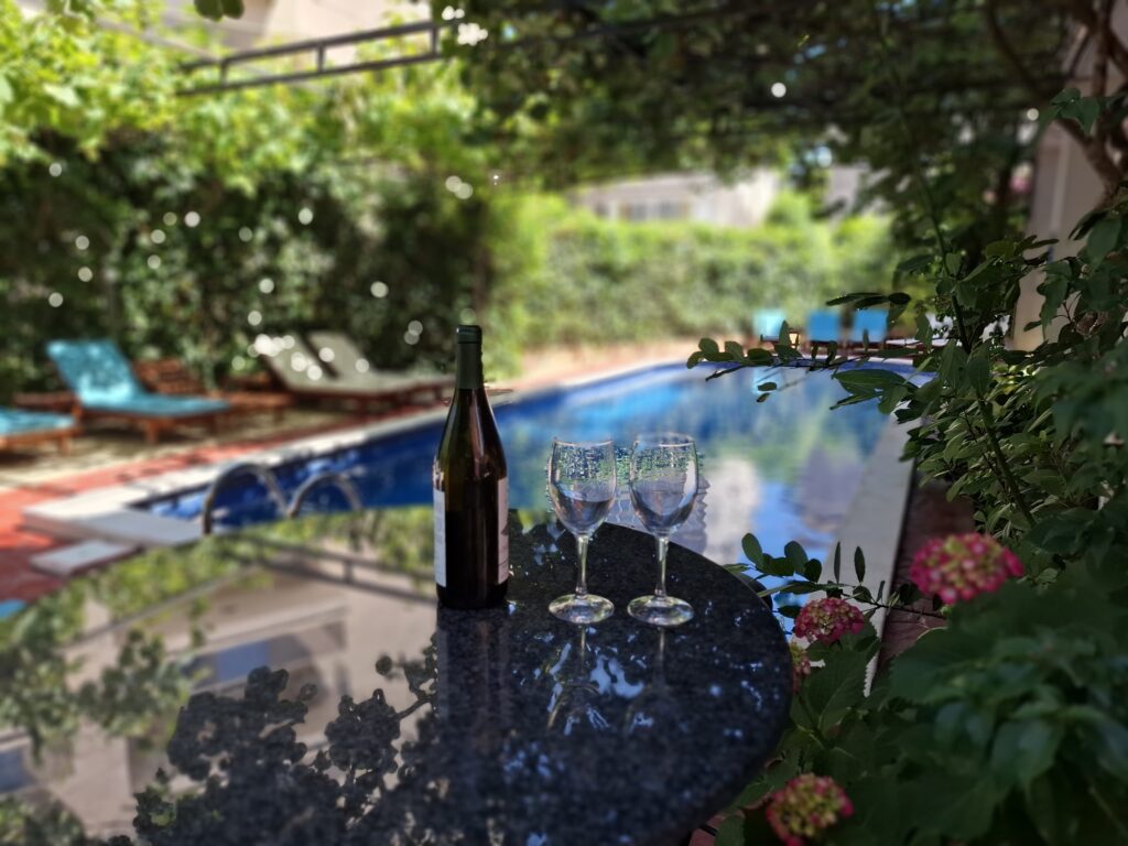 wine served on table by the pool