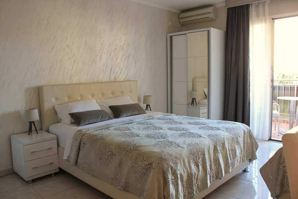 a king size bed in hotel room