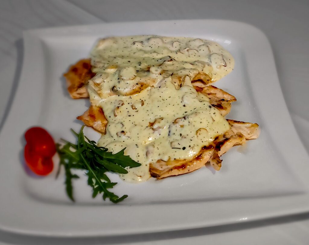 chicken in sauce on a plate