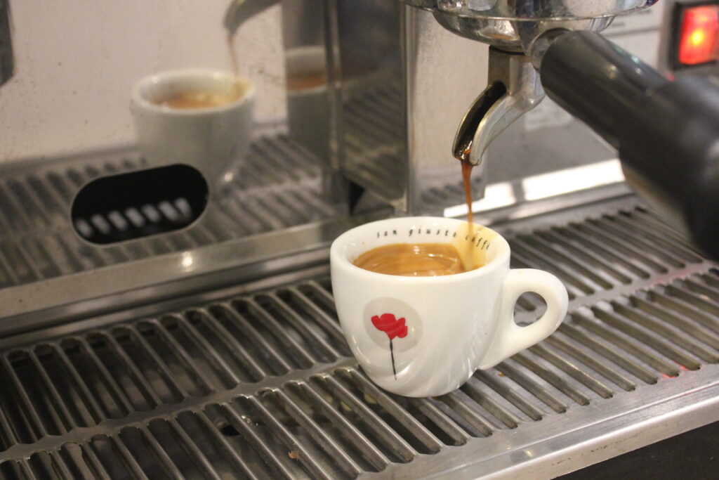 a cup of coffee from espresso machine