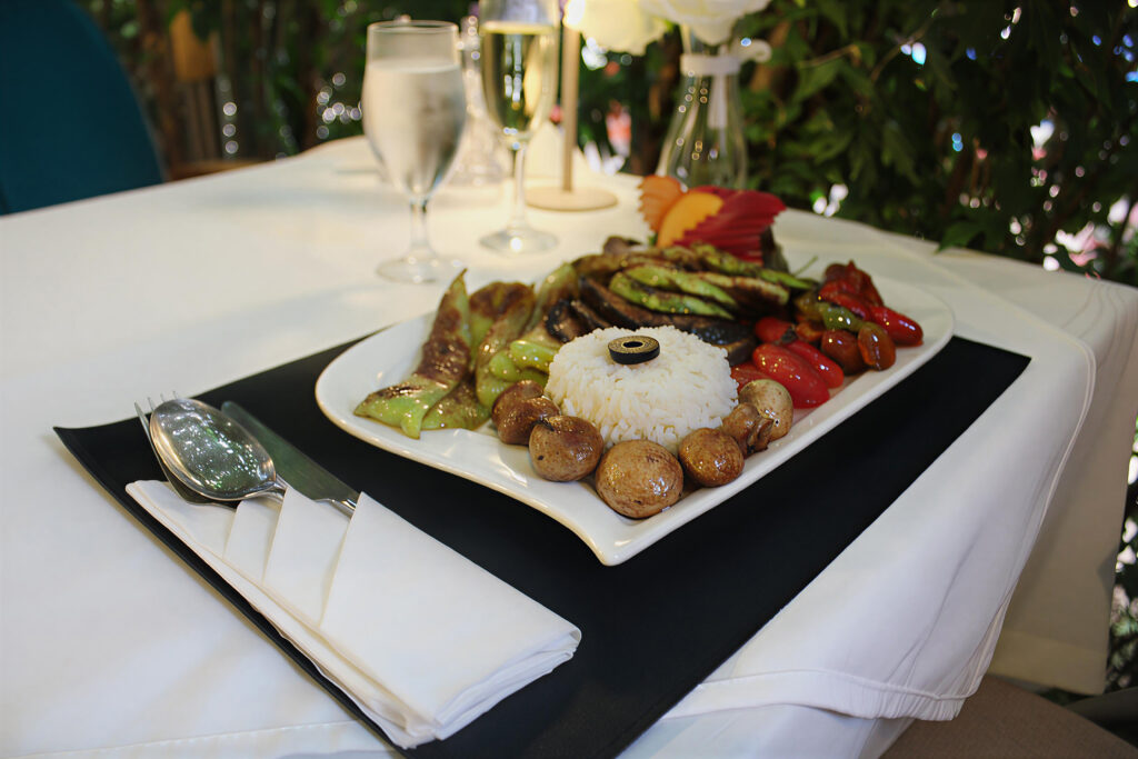 a plate of food served on a table in restaurant for dinner