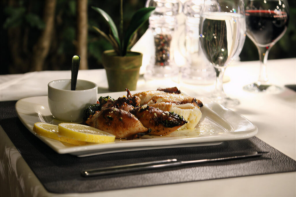 a plate of food served for dinner with drinks