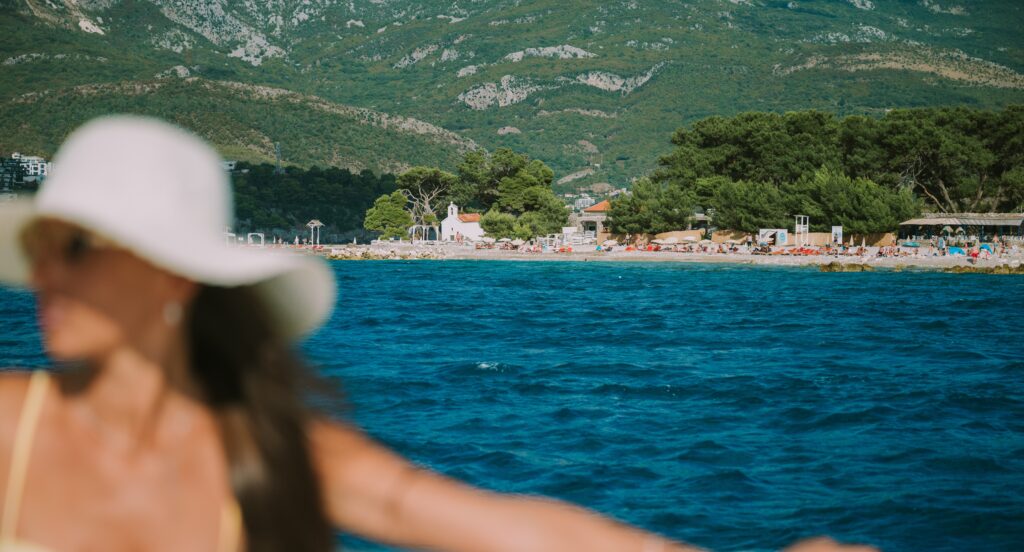 girl-on-boat-beach-behind-her