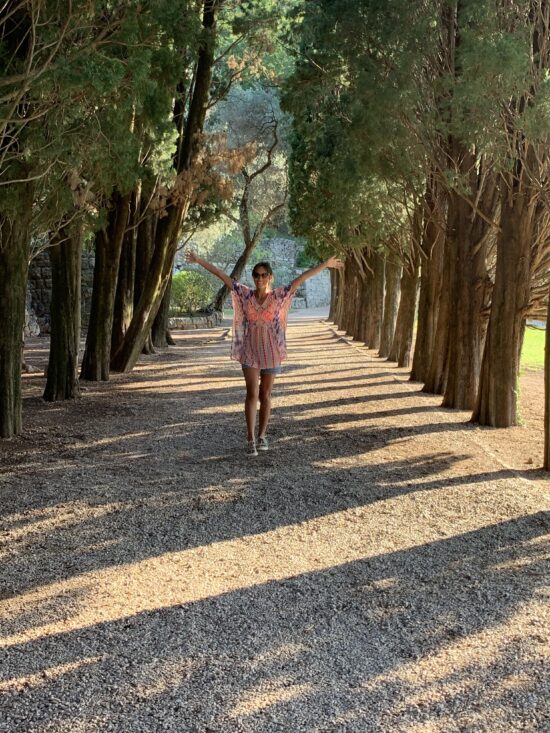 girl-standing-between-trees