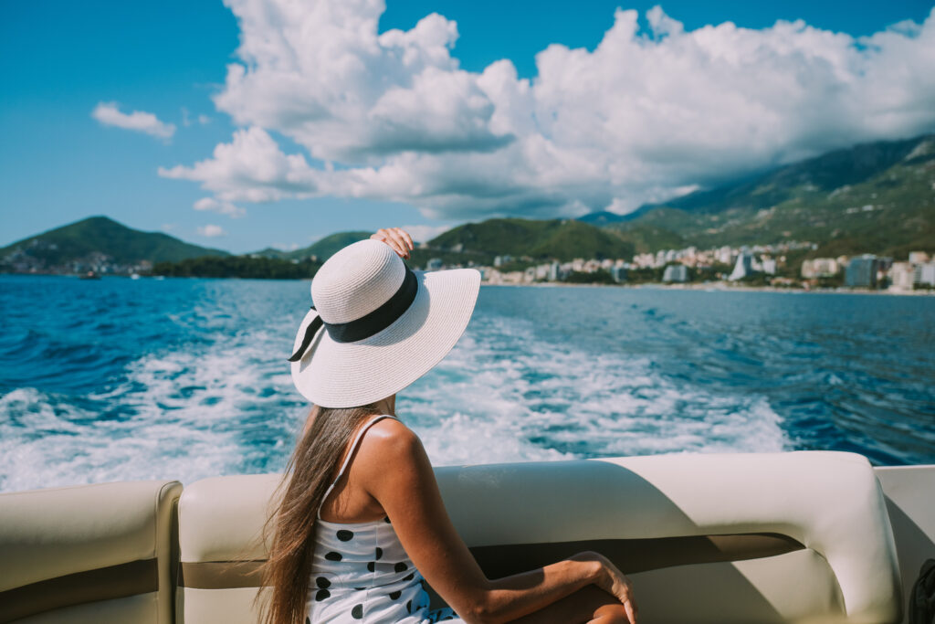girl-with-hat-watching-coast