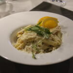 pasta with chicken and vegetables served on a plate